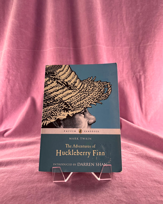 The Adventures of Huckleberry Finn (Puffin Classics) by Mark Twain