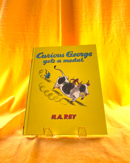 Curious George Gets a Medal - H.A. Rey