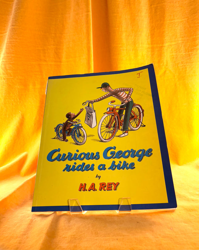 Curious George Rides a Bike (Paperback)