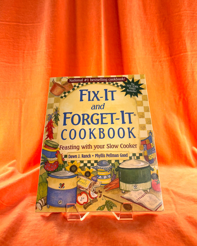 Cookbook titled 'Fix-It and Forget-It Cookbook' on a bright orange background