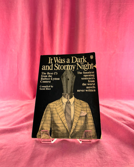 Book titled 'It Was a Dark and Stormy Night' on a pink fabric background