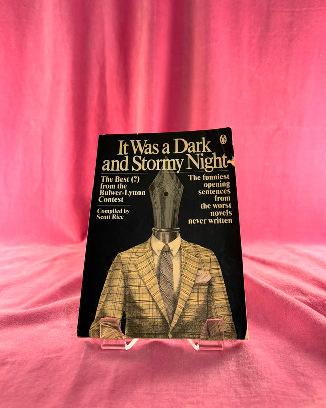 Book titled 'It Was a Dark and Stormy Night' on a pink fabric background
