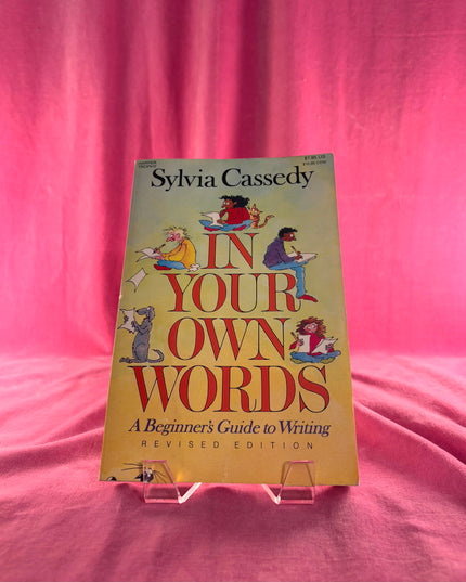 Book titled 'In Your Own Words' by Sylvia Cassedy on a pink background