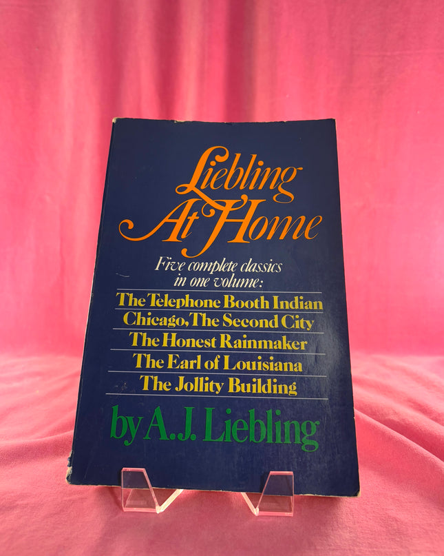 Book titled 'Liebling At Home' by A.J. Liebling on a pink background