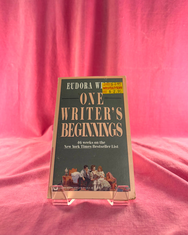 Book titled 'One Writer's Beginnings' by Eudora Welty on a pink fabric background