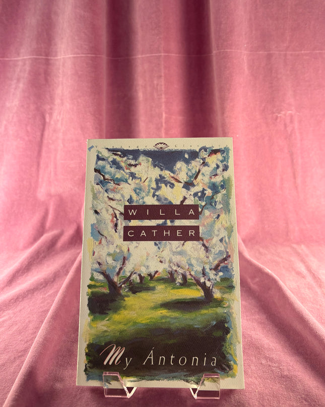 Book cover of 'My Antonia' by Willa Cather on a pink fabric background