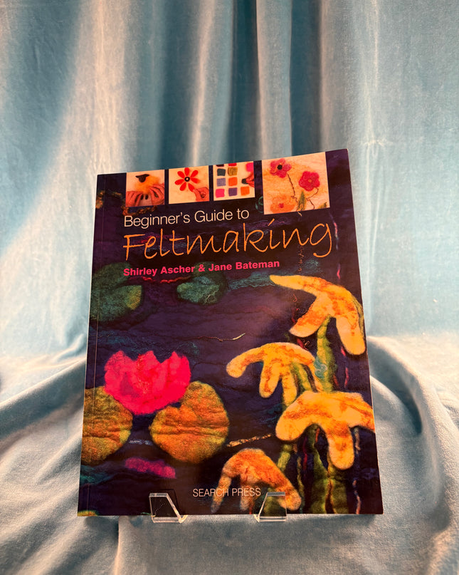 Book titled 'Beginner's Guide to Felting' on a textured surface