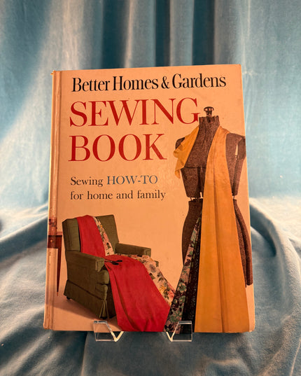 Better Homes & Gardens Sewing Book on a textured fabric background