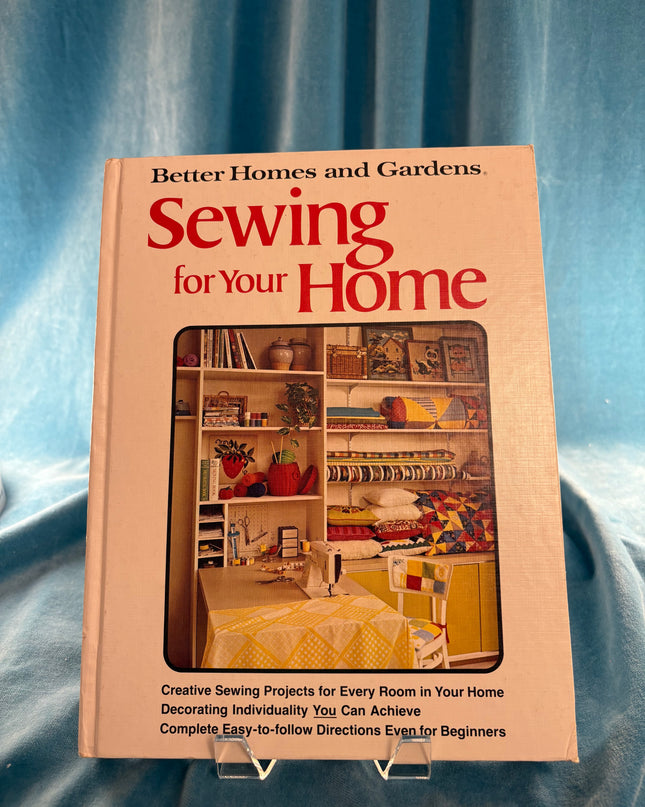 Book titled 'Sewing for Your Home' by Better Homes and Gardens on a blue fabric background