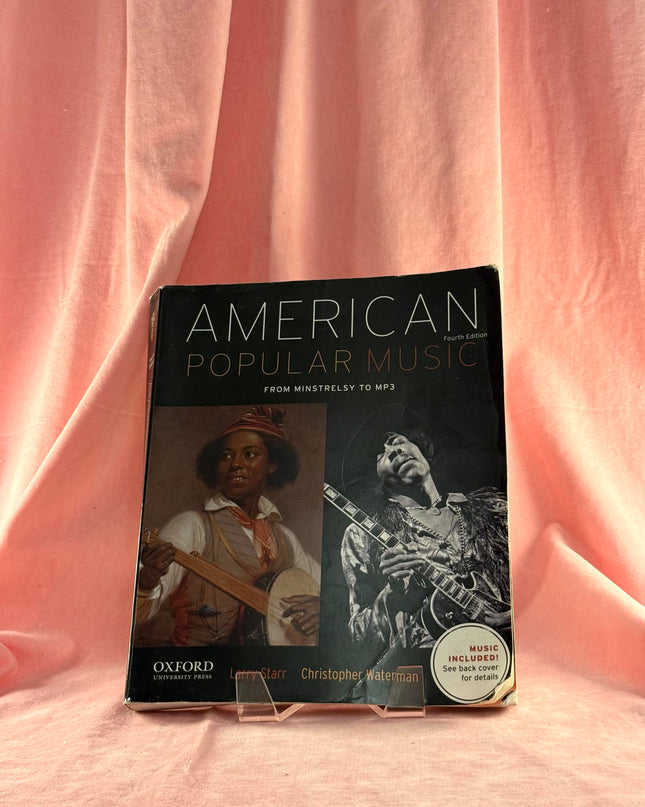 Book titled 'American Popular Music' by Oxford University Press on a pink fabric background