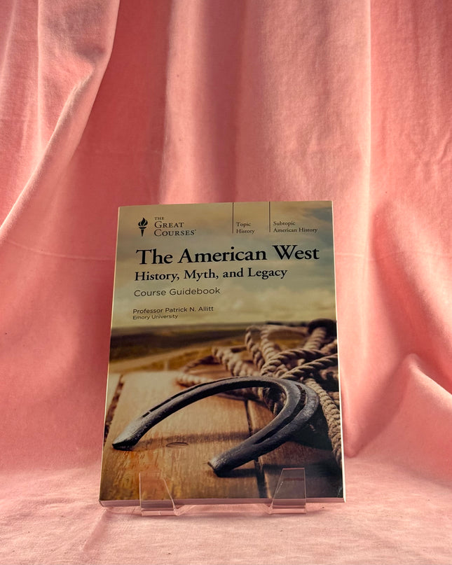 Book titled 'The American West: History, Myth, and Legacy' by The Great Courses on a pink fabric background