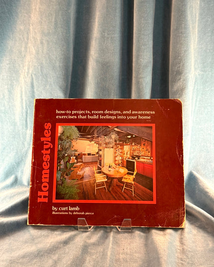 Book titled 'Homestyles' on a textured fabric background