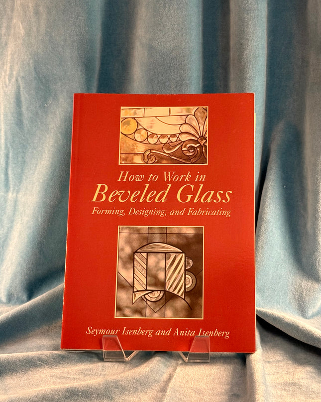 Book titled 'How to Work in Beveled Glass' on a gray fabric background