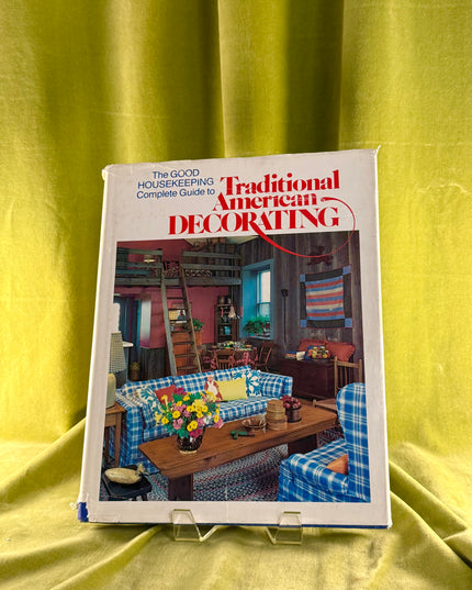 Book titled 'Traditional American Decorating' on a yellow fabric background