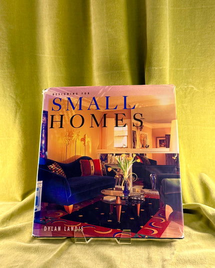 Book titled 'Small Homes' by Dylan Landis on a yellow fabric background