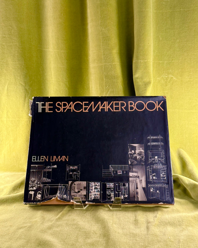Book titled 'The Spacemaker Book' by Ellen Liman on a green fabric background