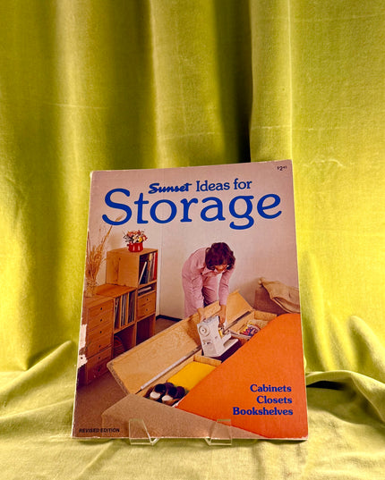 Book titled 'Ideas for Storage' by Sunset on a yellow fabric background