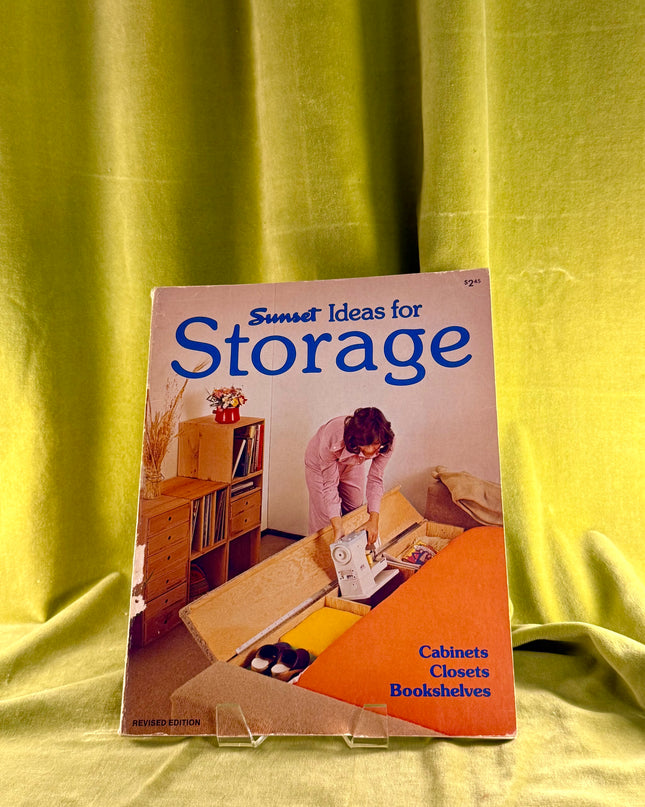 Book titled 'Ideas for Storage' by Sunset on a yellow fabric background