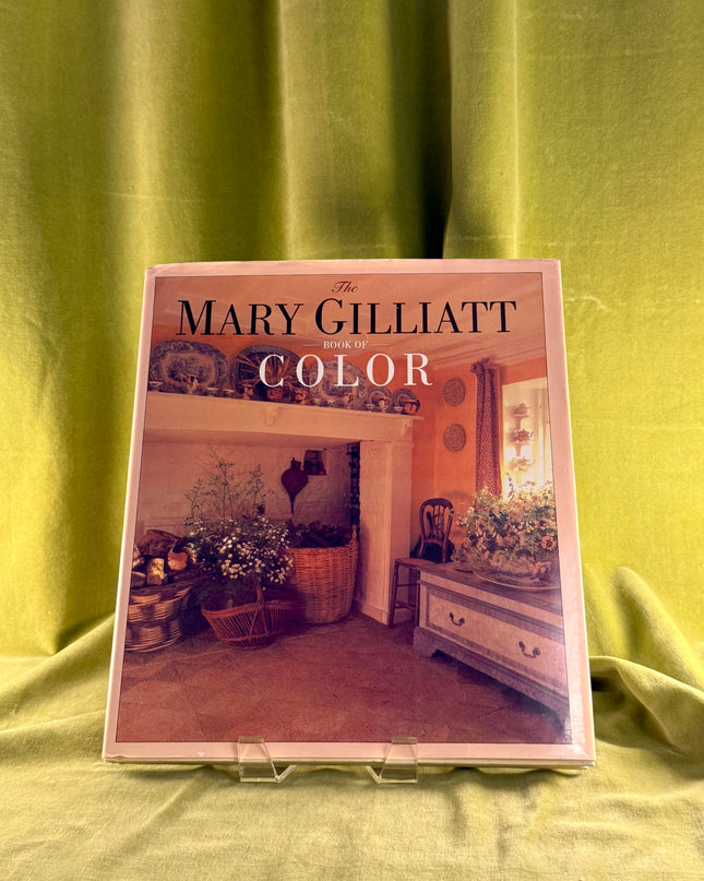 Book titled 'The Mary Gilliatt Color' on a green fabric background