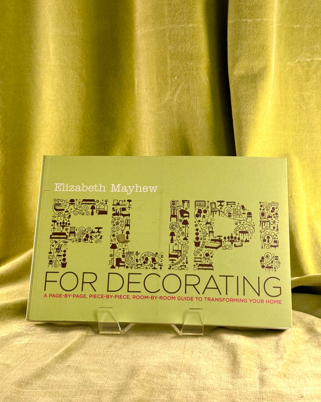 Book titled 'Flip for Decorating' by Elizabeth Mayhew on a green fabric background