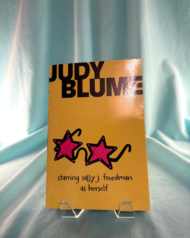 Book cover of 'Judy Blume' with star illustrations on a light blue background