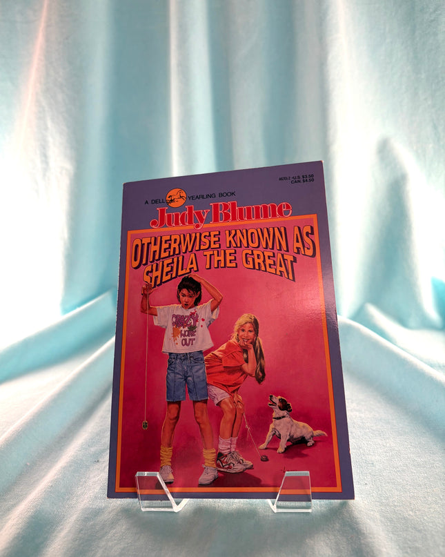 Book titled 'Judy Blume: Otherwise Known as Sheila the Great' on a light blue curtain background
