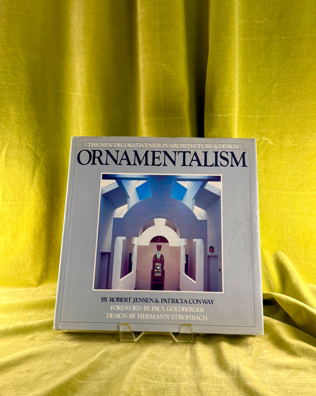 Book titled 'Ornamentalism' on a yellow fabric background