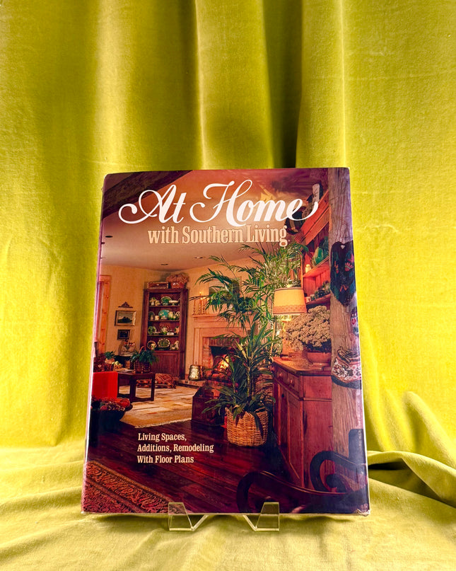Book titled 'At Home with Southern Living' on a yellow fabric background