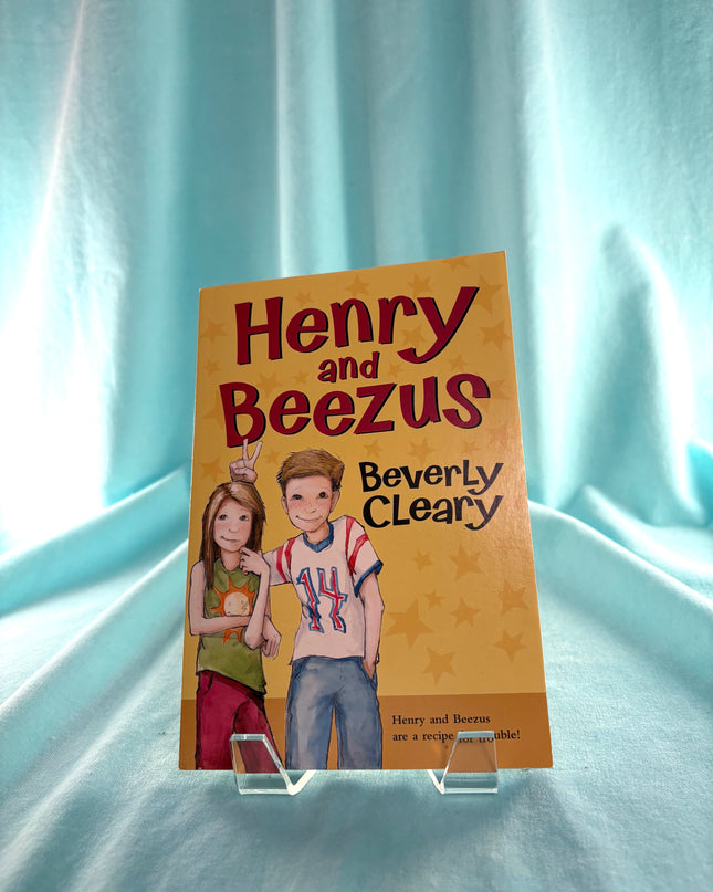 Book cover of 'Henry and Beezus' by Beverly Cleary on a light blue curtain background