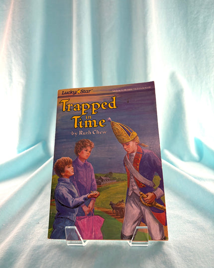 Book titled 'Trapped Time' by Ruth Chew on a light blue curtain background