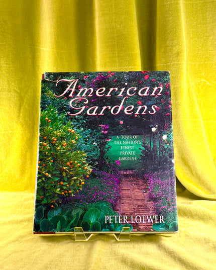 Book titled 'American Gardens' by Peter Loewer on a yellow background