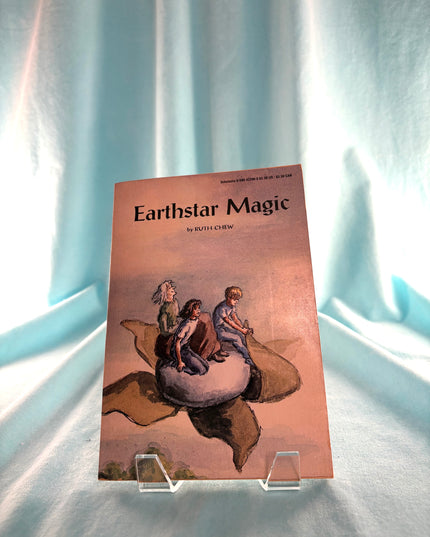 Book titled 'Earthstar Magic' on a light blue background