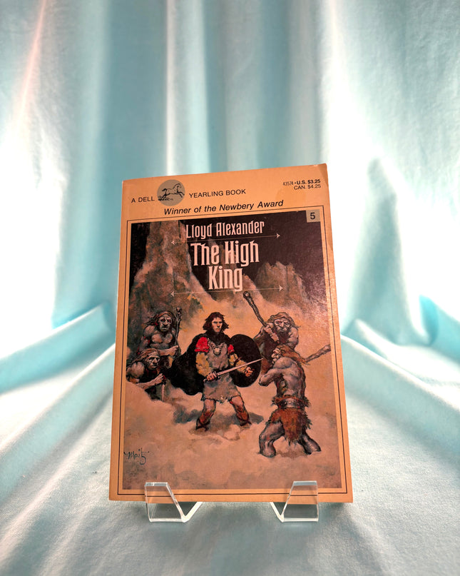 Book titled 'The High King' by Lloyd Alexander on a stand against a light background