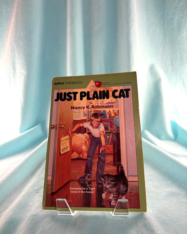 Book titled 'Just Plain Cat' by Nancy K. Robinson on a white background