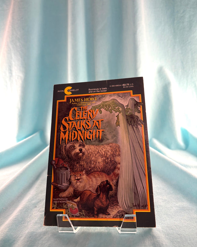 Book titled 'Cerberus Stalks at Midnight' by James Howe on a light blue background