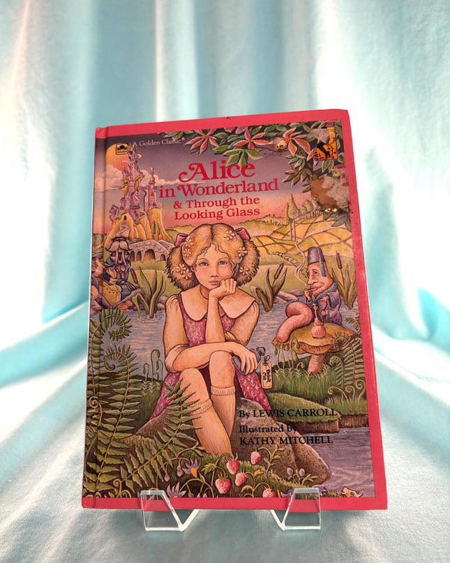 Book cover of 'Alice in Wonderland & Through the Looking Glass' on a stand with a light blue background