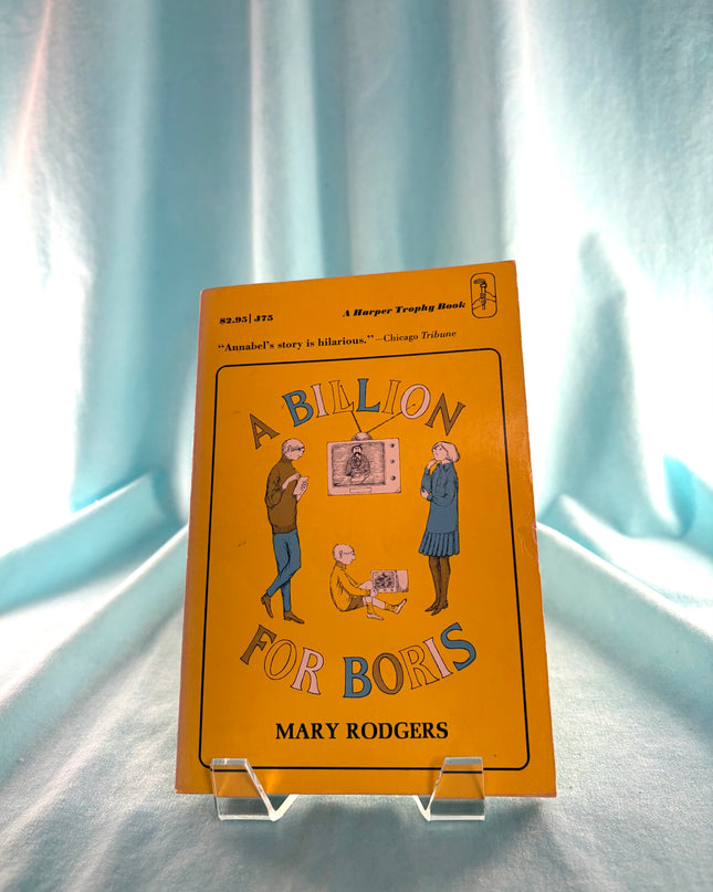 Book titled 'A Billion for Boris' by Mary Rodgers on a stand with a light blue curtain background