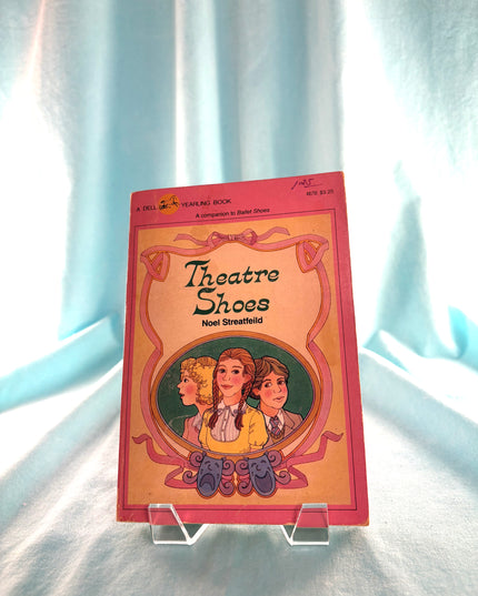 Book titled 'Theatre Shoes' by Noel Streatfeild on a white background