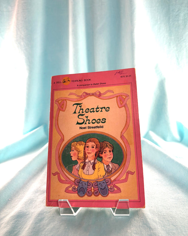 Book titled 'Theatre Shoes' by Noel Streatfeild on a white background