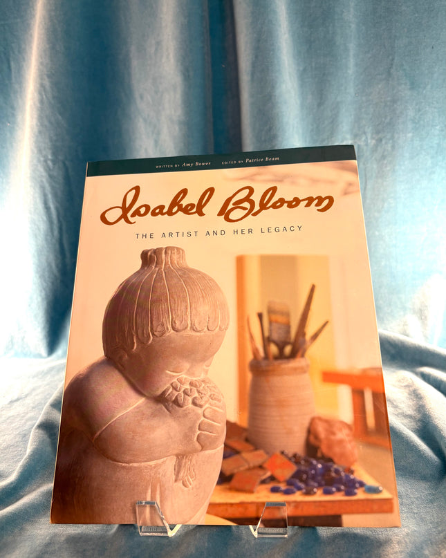 Book titled 'Isabel Bloom: The Artist and Her Legacy' on a textured surface