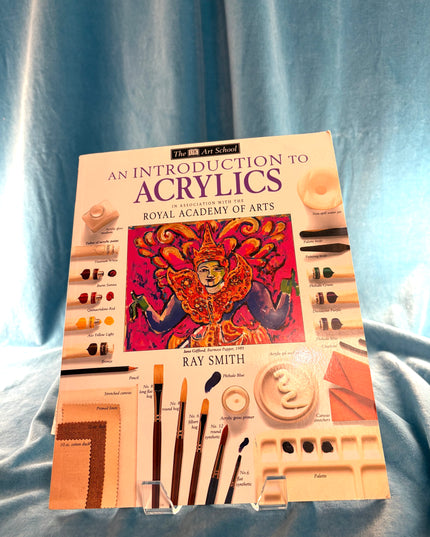 Book titled 'An Introduction to Acrylics' by Ray Smith on a blue fabric background