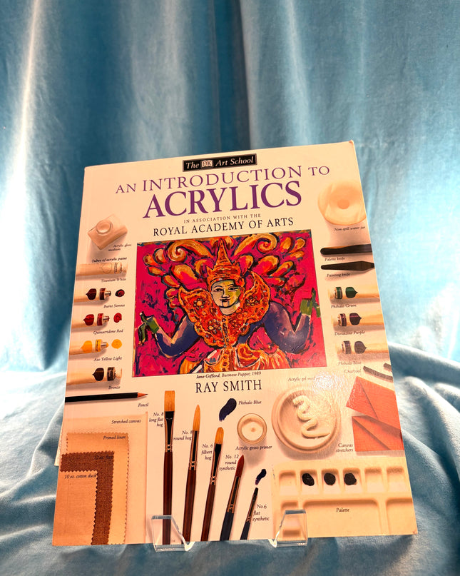 Book titled 'An Introduction to Acrylics' by Ray Smith on a blue fabric background