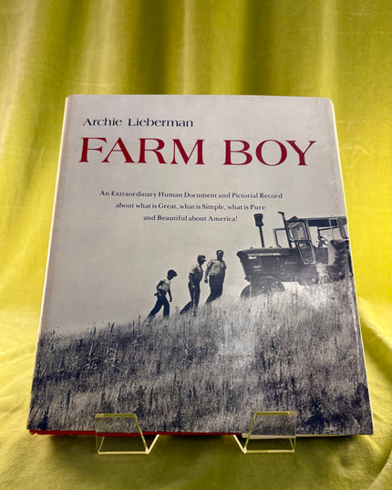Book titled 'Farm Boy' by Archie Lieberman on a yellow background