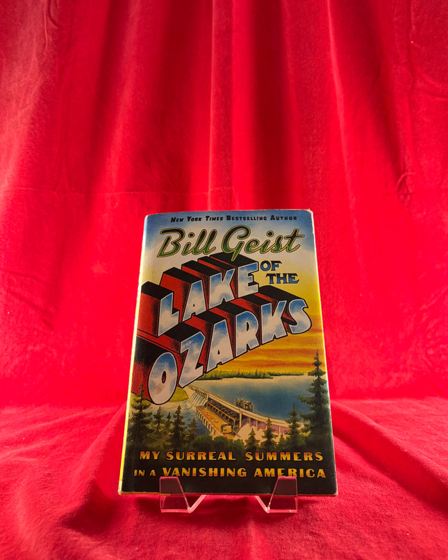 Book titled 'Lake of the Ozarks' by Bill Geist on a red background